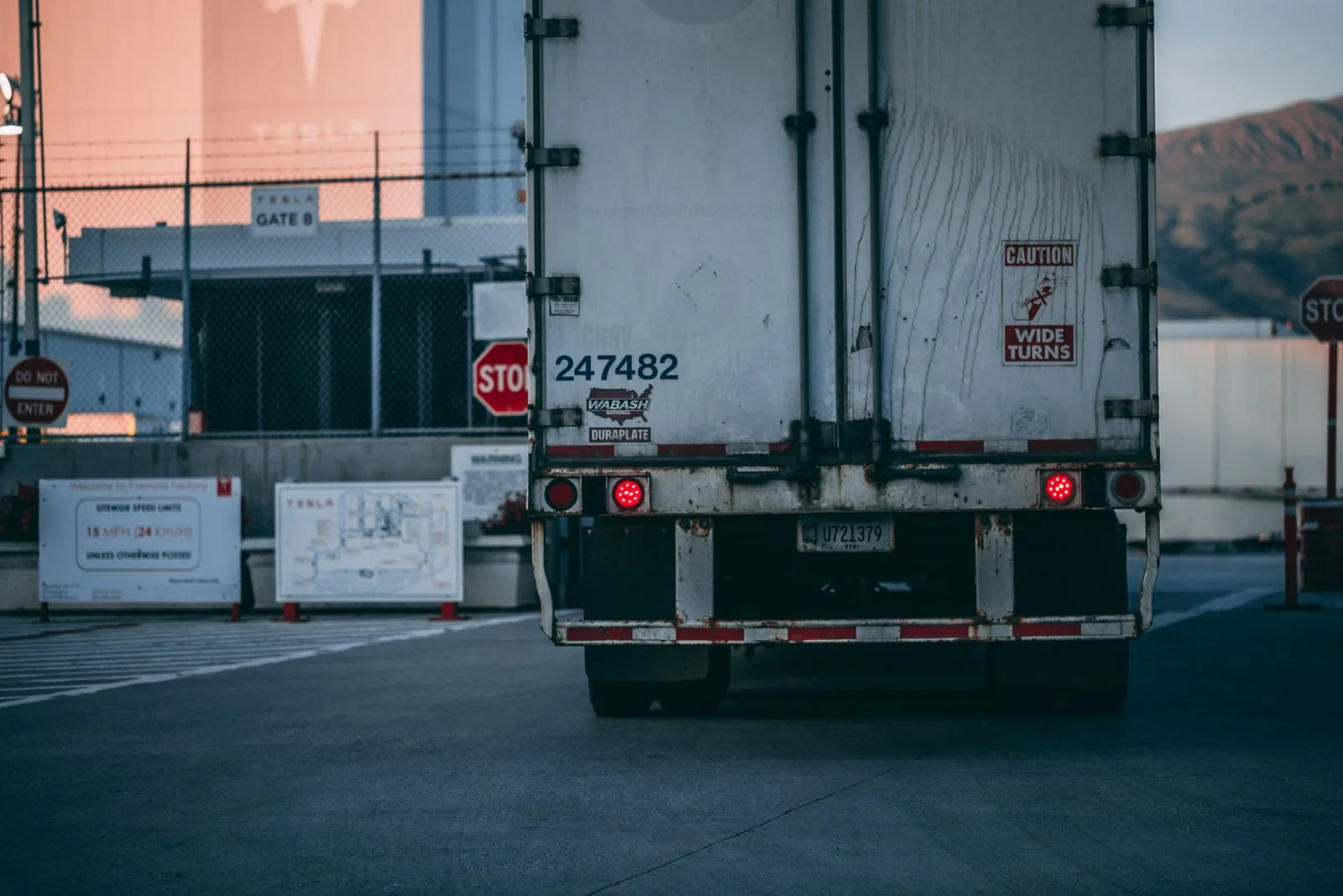 Freight trailer moving through an American logistics terminal