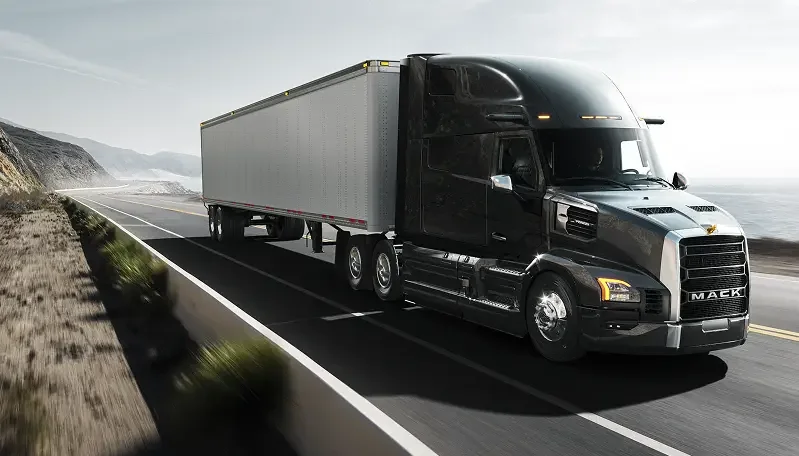New Mack Pioneer hauling freight along a coastal American highway